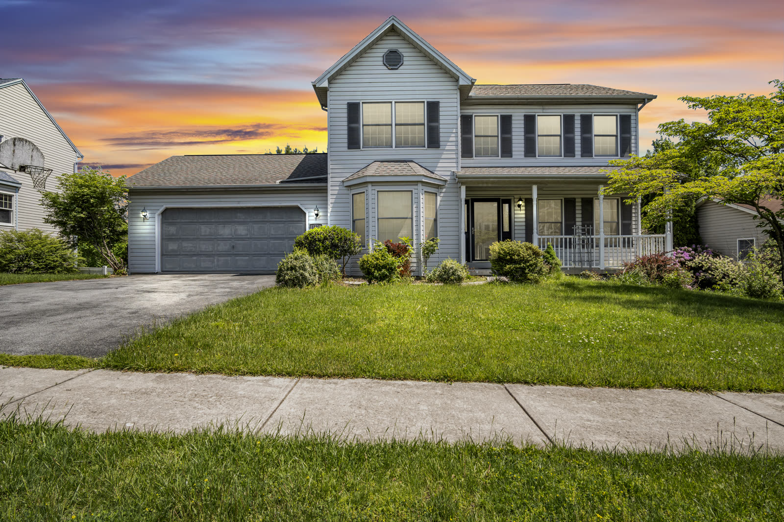 Day-to-dusk exterior listing photo